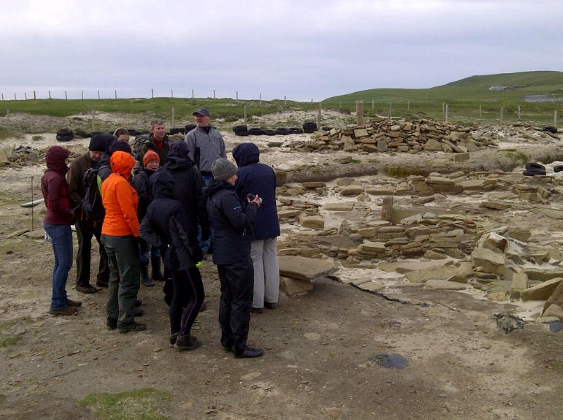 A tour group on site at the Links of Noltland in Westray