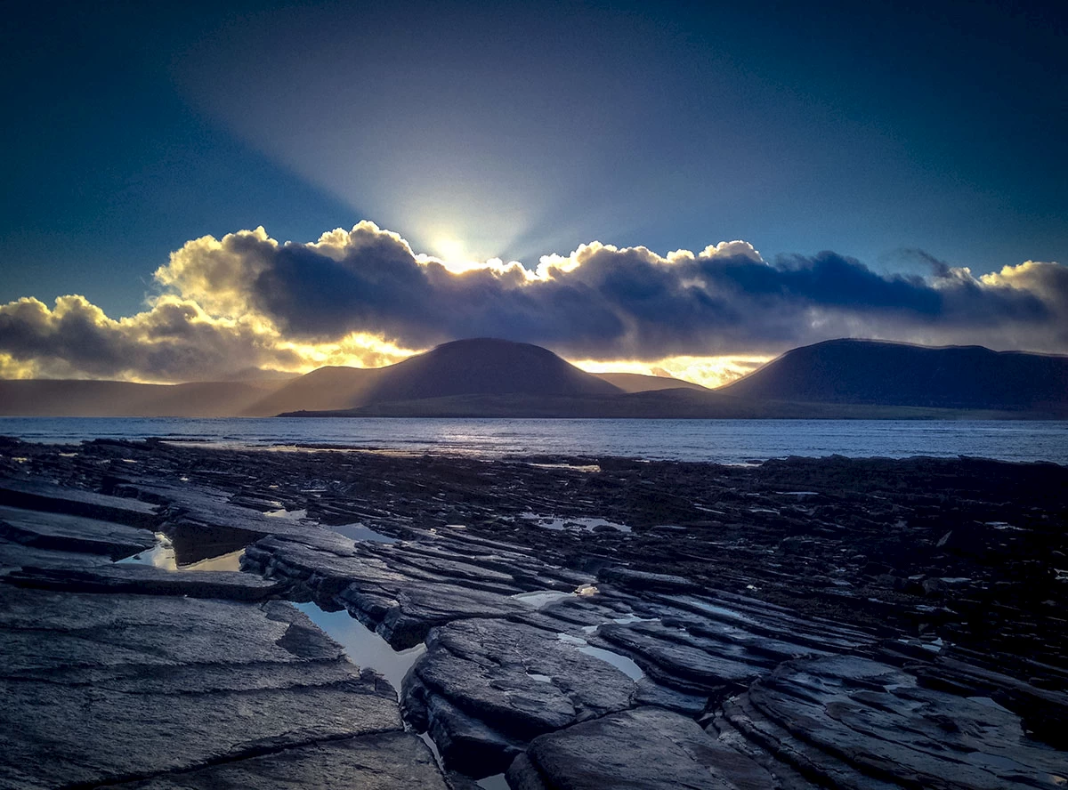 Winter sun over the Hoy Hills - image by Sigurd Towrie