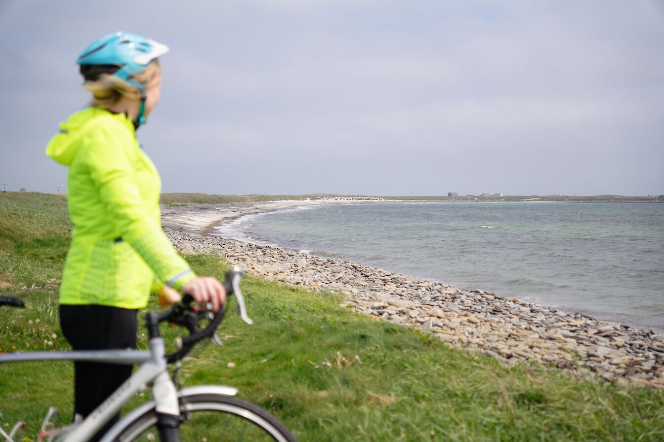 Cyclist at Lopness, Sanday, Orkney