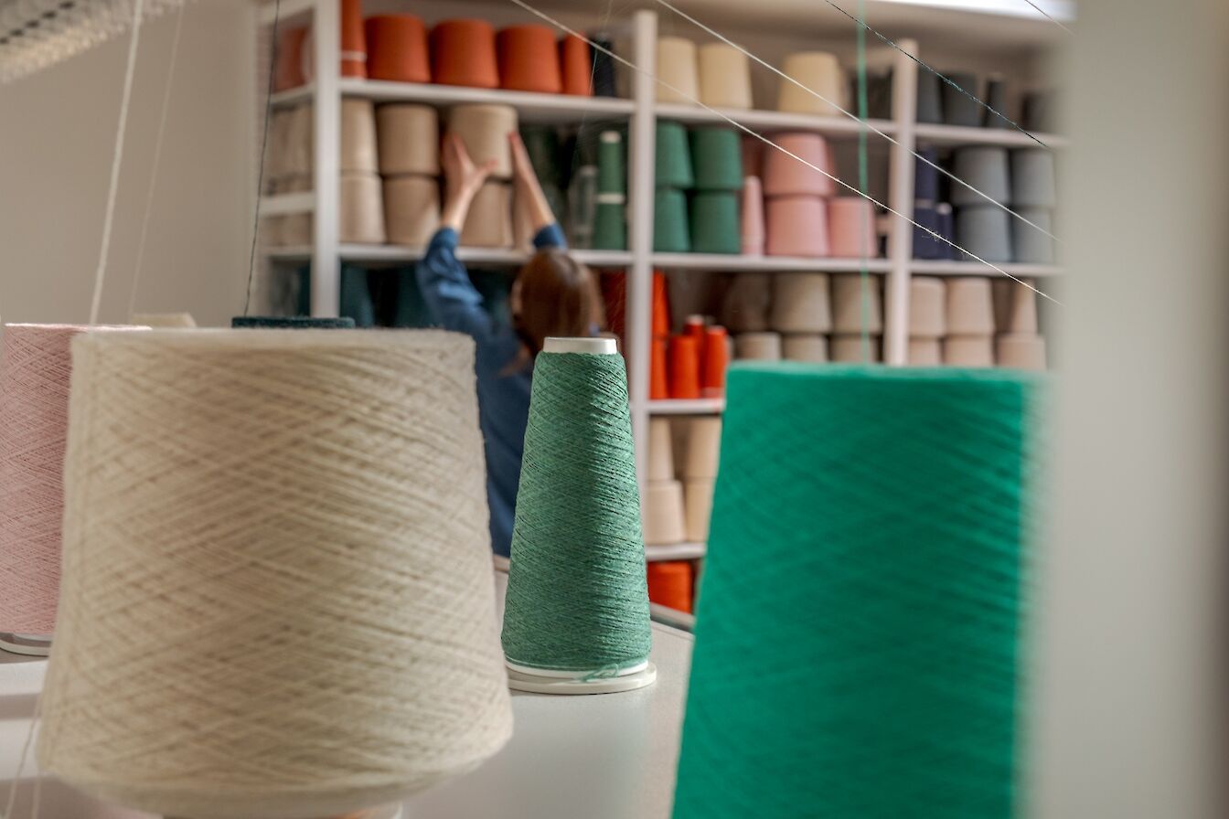 Yarn on the new knitting machine at the Hilary Grant factory.