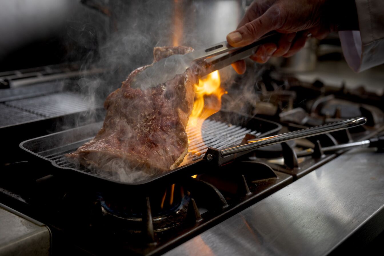 Cooking steak at the Stronsay Hotel, Orkney