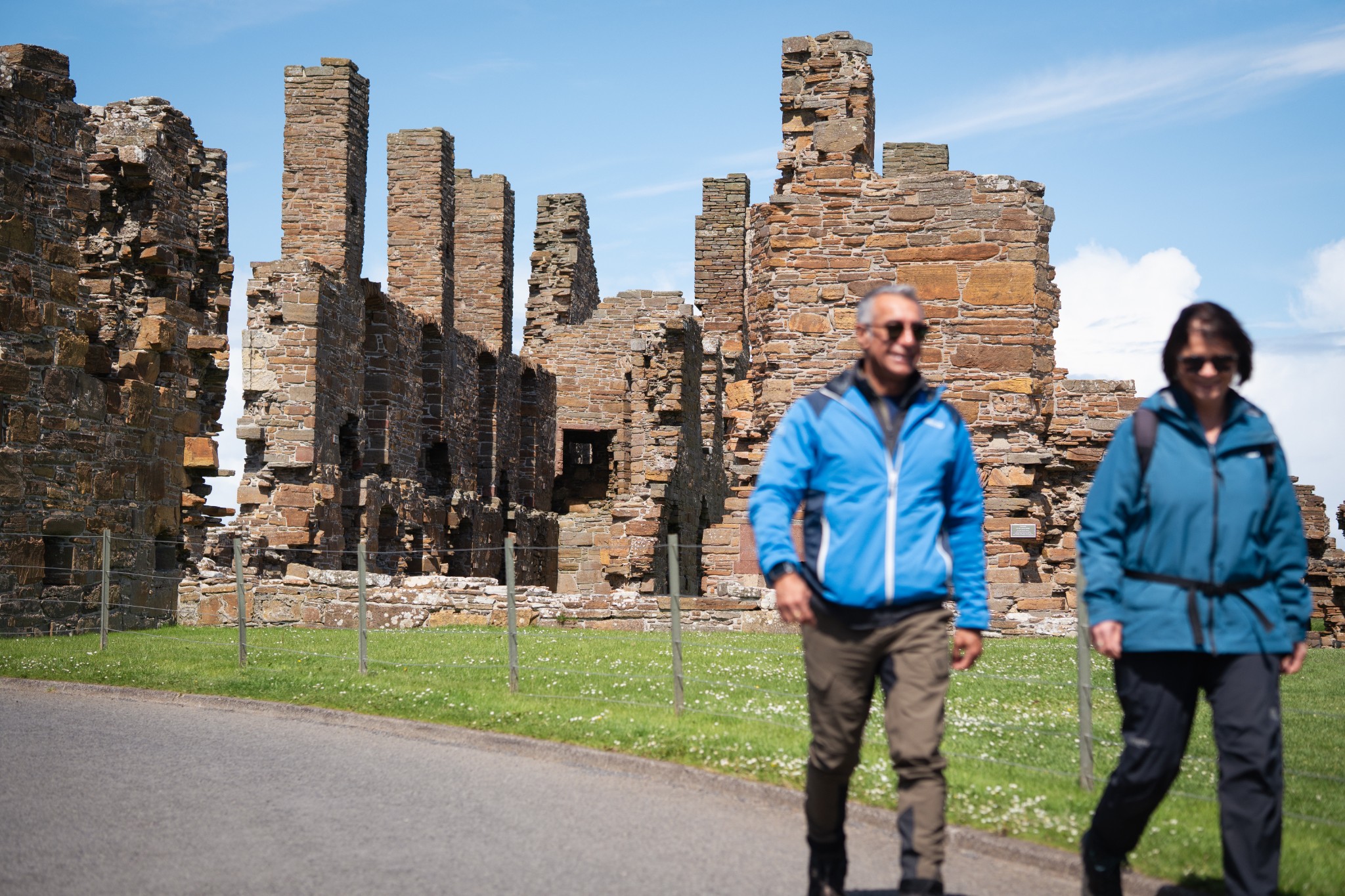 Walkers at Earl's Palace, Birsay, Orkney