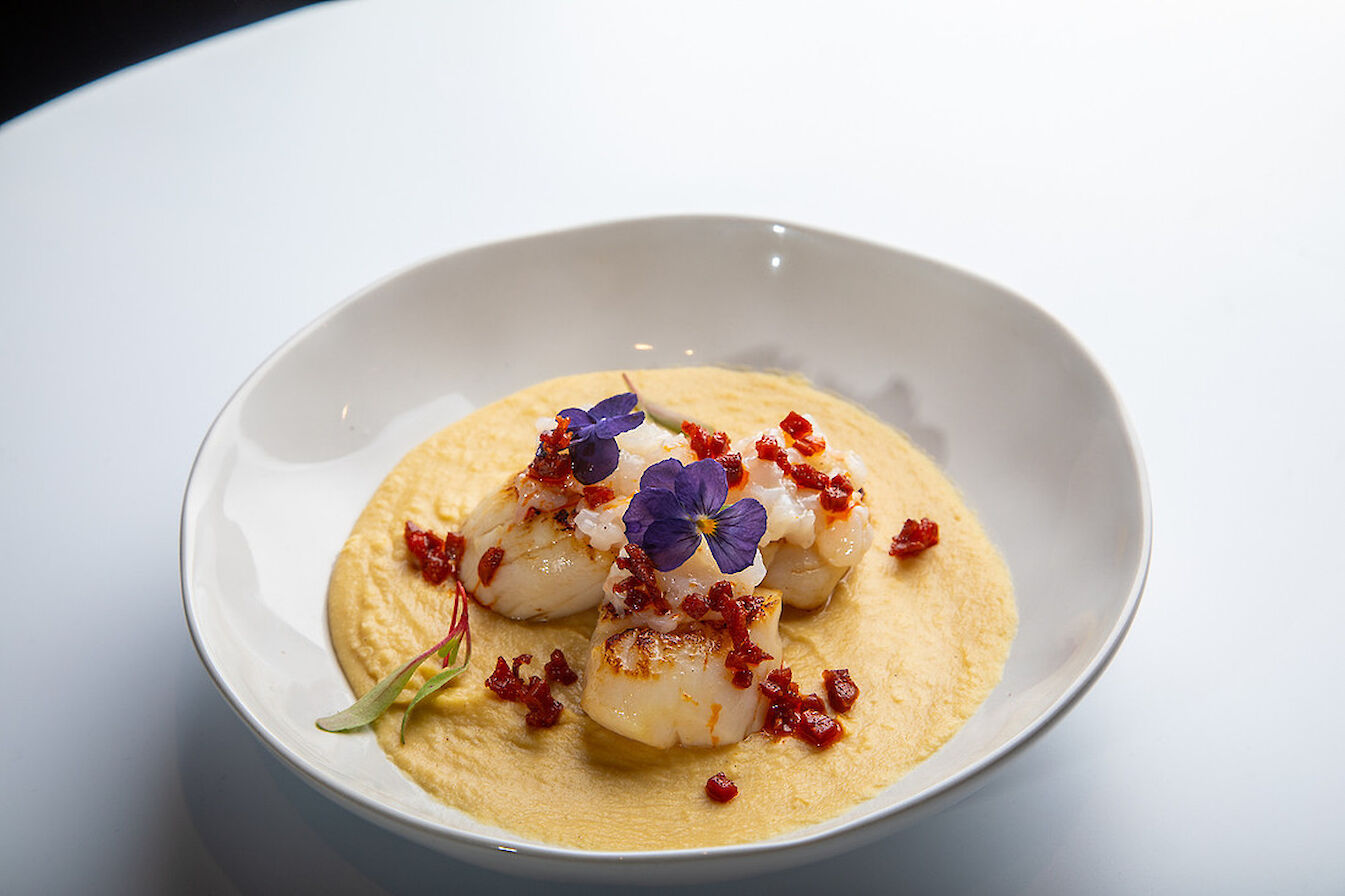 Paolo Cherubini's 'dish of the night' of seared hand-dived scallop with prawn tartare and crisp chorizo on chickpea puree.